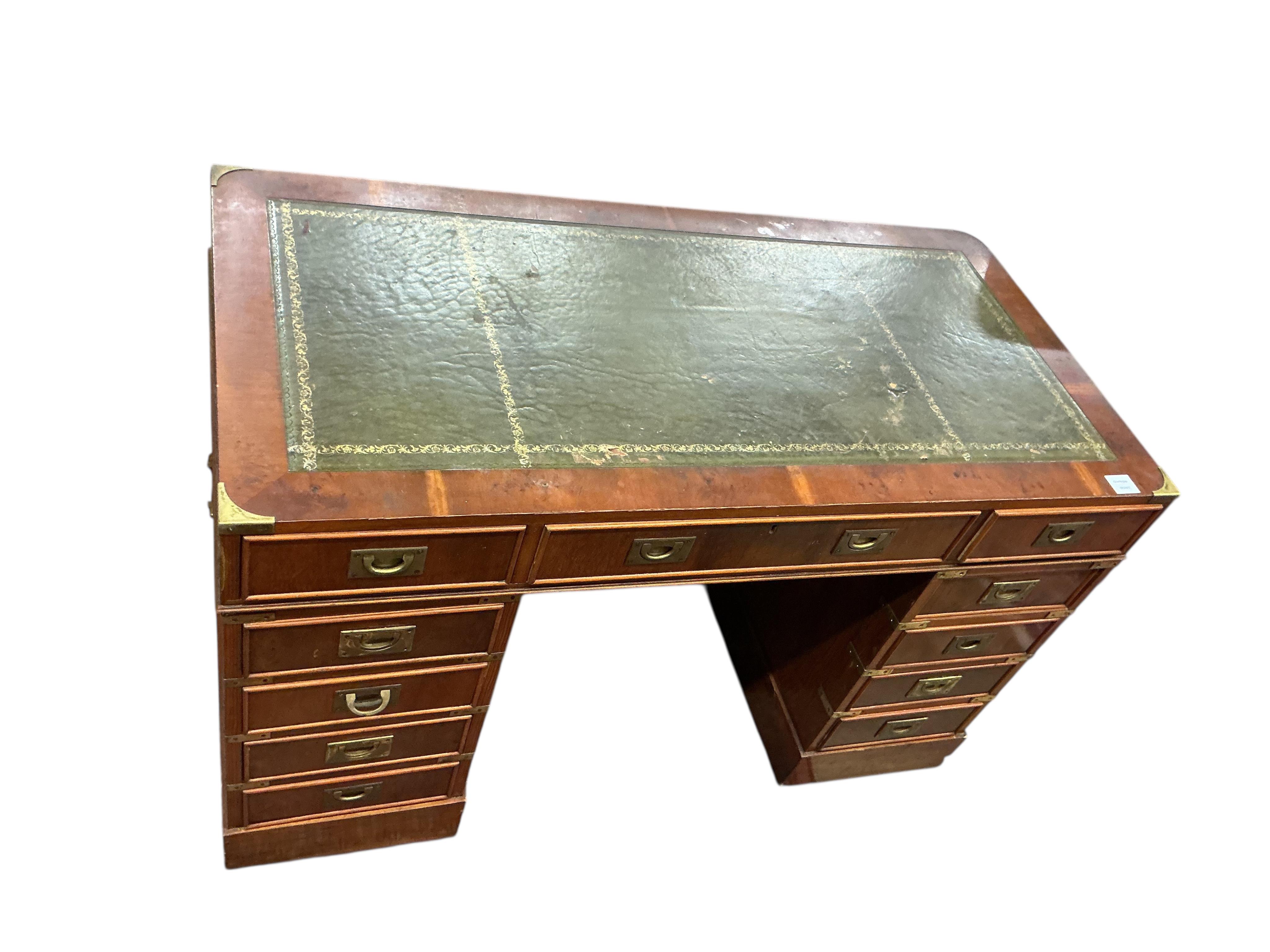 A reproduction brass mounted yew pedestal desk, width 121cm, depth 60cm, height 76cm